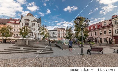 Panorama showing Neptune fountain on Old Town Market Square timelapse with historical houses around. 112052264