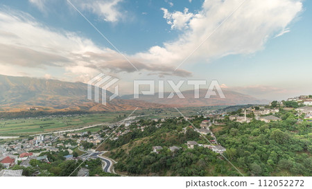 Panorama showing Gjirokastra city from the viewpoint of the fortress of the Ottoman castle of Gjirokaster timelapse. 112052272