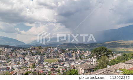 Panorama showing Gjirokastra city from the viewpoint with many typical hystoric houses of Gjirokaster timelapse. 112052275