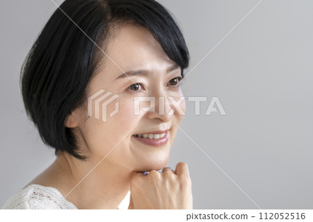 Beauty image portrait of a woman in her early 50s 112052516