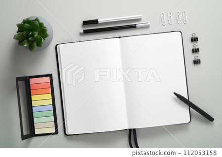 Blank notebook page for your text with black pen and pencil on gray background. Blank notebook page for your text with black pen and pencil on gray background. 112053158