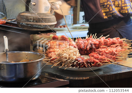 Yakitori skewers - Yakitori restaurant preparation 112053544