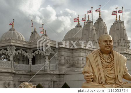 The gold colored statue of spiritual leader holiness pramukh swami maharaj front of Neasden temple. The gold colored statue of spiritual leader holiness pramukh swami maharaj front of Neasden temple. 112053754