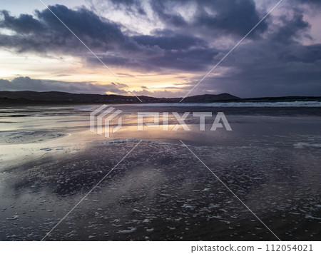Beautiful sunset at Portnoo Narin beach in County Donegal - Ireland Beautiful sunset at Portnoo Narin beach in County Donegal - Ireland 112054021