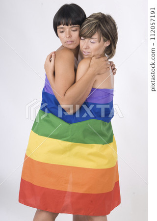 couple of women in love with lesbian rainbow flag couple of women in love with lesbian rainbow flag 112057191