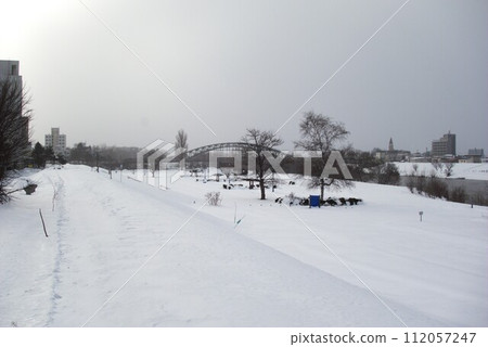 Asahikawa in winter seen from the embankment near Ishikari River [Asahikawa, Hokkaido] 112057247
