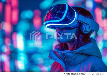 Video gaming player in VR headset playing virtual reality games in 3D VR equipment 112058430