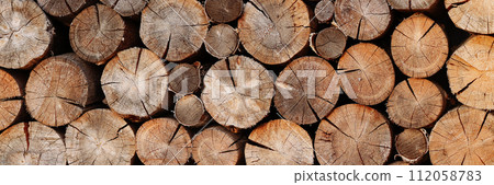 Banner woodpile pattern or texture. Round cuts of wood. Banner woodpile pattern or texture. Round cuts of wood. 112058783