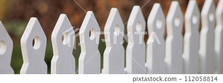 Banner detailed view of white picket fence Banner detailed view of white picket fence 112058814