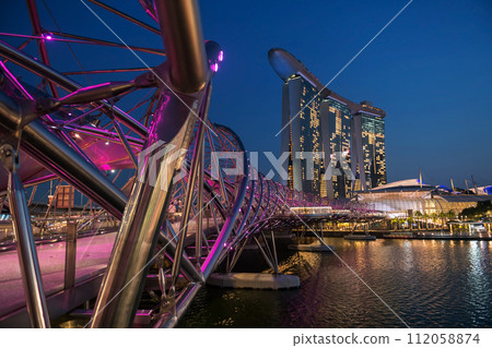 Helix bridge purple light up at disk in Marina Bay, Singapore Helix bridge purple light up at disk in Marina Bay, Singapore 112058874
