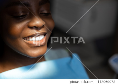 Woman patient getting dental treatment Woman patient getting dental treatment 112060078