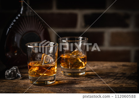 Whiskey with ice in glasses 112060588