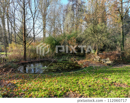 Enlgish green garden with water pound and multpiple type of trees and plants Enlgish green garden with water pound and multpiple type of trees and plants 112060717
