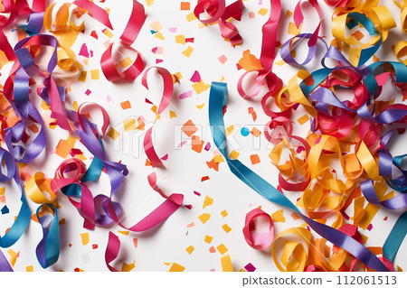 Colorful streamers and confetti scattered over a surface, suggesting a celebration or party atmosphere. 112061513