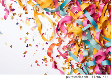 Colorful streamers and confetti scattered over a surface, suggesting a celebration or party atmosphere. 112061515