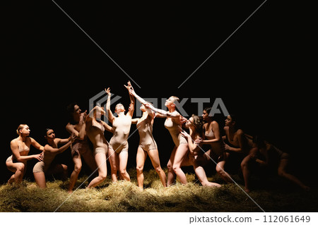 Group of modern ballet dancers. Contemporary art. Young flexible athletic men and women. 112061649