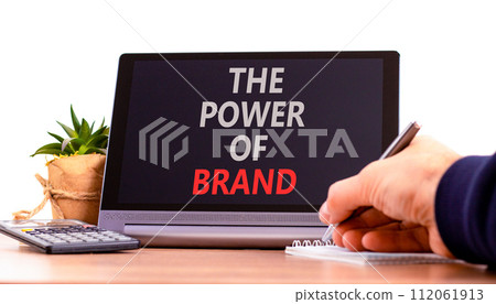 The power of brand symbol. Concept words The power of brand on beautiful black tablet. Beautiful white background. Businessman hand. Calculator. Business the power of brand concept. Copy space. The power of brand symbol. Concept words The power of brand on beautiful black tablet. Beautiful white background. Businessman hand. Calculator. Business the power of brand concept. Copy space. 112061913