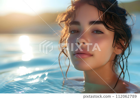 Serenity Oasis: Young Woman Basks in Outdoor Spa Pool Beauty 112062789