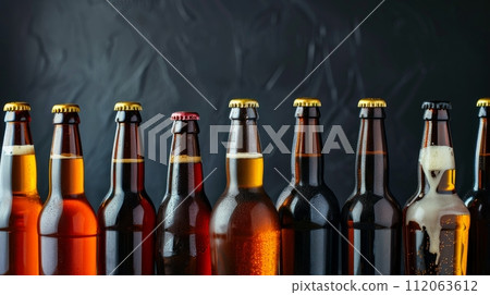 A collection of craft beer bottles showcasing a wide range of beer styles and flavors 112063612