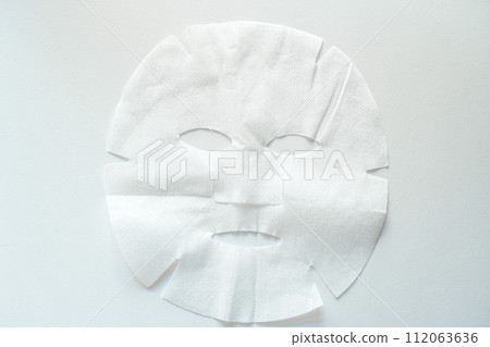 Facial mask with plenty of moisturizing ingredients on white background Facial mask with plenty of moisturizing ingredients on white background 112063636