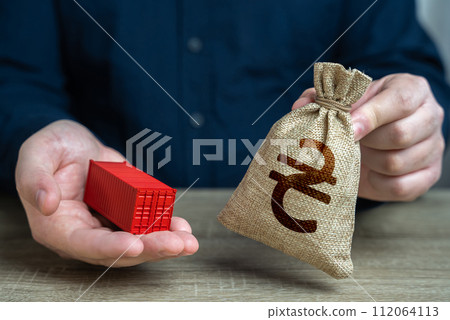 Ship container and ukrainian hryvnia money bag. Trade and delivery. Distribution logistics worldwide. Transportation and freight of goods and cargo through ports or overland routes. 112064113