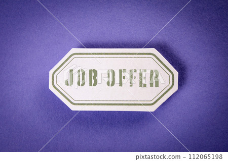 JOB OFFER. Sticky note with text on purple background 112065198