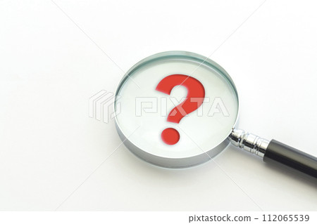 magnifying glass and red question mark 112065539