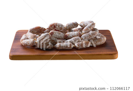 mini salami sausages on cutting board isolated on a white background. 112066117