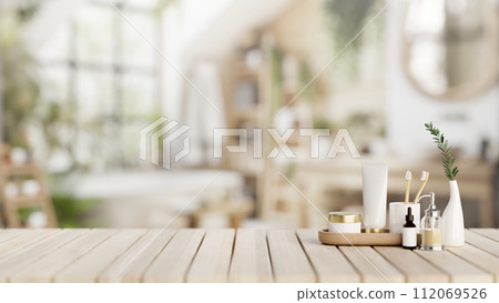 A set of facial cream, toiletries, and a presentation space on a wooden desk in a modern bathroom. 112069526
