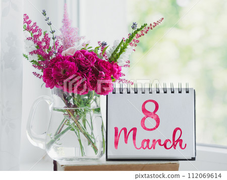 Bouquet of bright flowers standing in a vase Bouquet of bright flowers standing in a vase 112069614