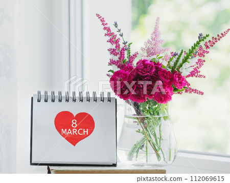 Bouquet of bright flowers standing in a vase Bouquet of bright flowers standing in a vase 112069615