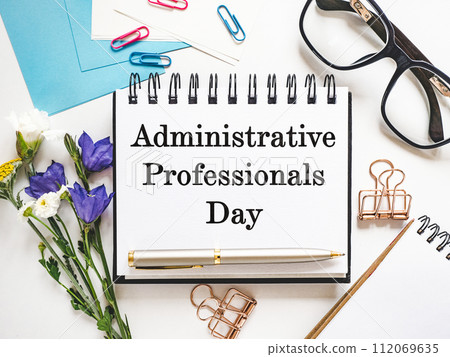 Happy Administrative Professionals Day. Notepad with congratulatory inscriptions Happy Administrative Professionals Day. Notepad with congratulatory inscriptions 112069635
