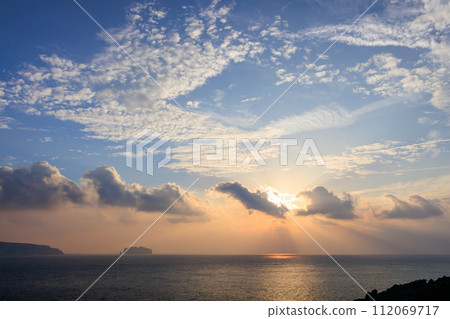 Beautiful sunrise, sea, Niijima, and Hayajima seen from Shikinejima Konokuchi Park. At Nejima, Izu Islands, Tokyo. November 2023 Beautiful sunrise, sea, Niijima, and Hayajima seen from Shikinejima Konokuchi Park. At Nejima, Izu Islands, Tokyo. November 2023 112069717
