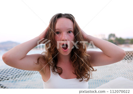 Huge Sale Or Promo Concept. Portrait of shocked asian woman looking at free copy space with opened mouth and spreading hands in disbelief, isolated on pink studio background, banner. High quality 112070022