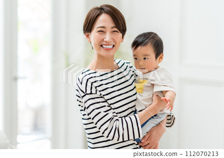 A mother holding a baby. A mother holding a baby. 112070213