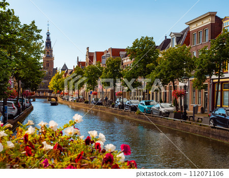 Summer Alkmaar cityscape along Mient canal with Waag building 112071106