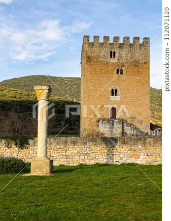Medieval high multi-storey Valcedoceda Tower among hills covered with greenery and forests, Spain Medieval high multi-storey Valcedoceda Tower among hills covered with greenery and forests, Spain 112071120