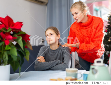 Teenage girl ignoring her mother before Christmas 112071622