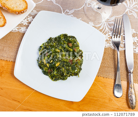 Traditional regional Spanish dish is spinach in Catalan Traditional regional Spanish dish is spinach in Catalan 112071789