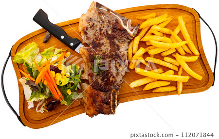 Beef served with potatoes and vegetable salad Beef served with potatoes and vegetable salad 112071844