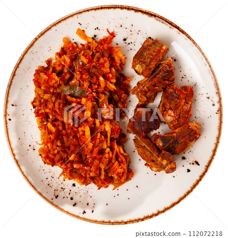 Delicious pork ribs in gravy with barley and cabbage stewed close up Delicious pork ribs in gravy with barley and cabbage stewed close up 112072218