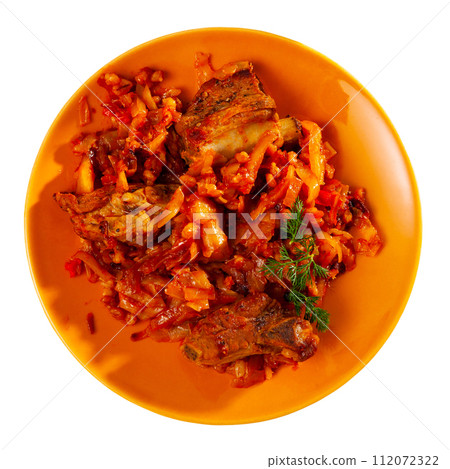 Smoked pork ribs, barley and stewed cabbage and on plate Smoked pork ribs, barley and stewed cabbage and on plate 112072322