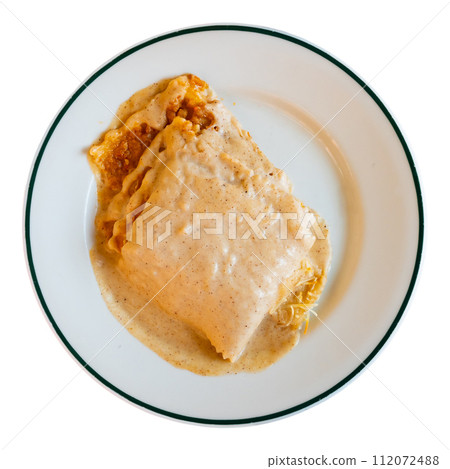Traditional Italian dish is lasagna baked in oven under cheese crust. 112072488