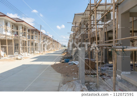 construction residential new house in progress at building site housing estate development construction residential new house in progress at building site housing estate development 112072591