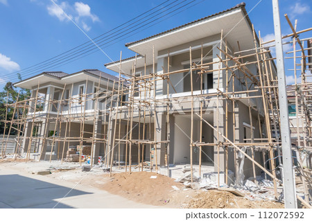construction residential new house in progress at building site housing estate development construction residential new house in progress at building site housing estate development 112072592