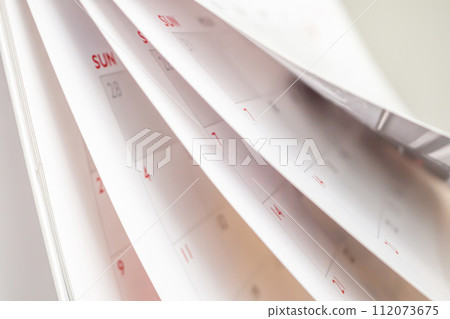 Calendar page flipping sheet close up blur background business schedule planning appointment meeting concept 112073675