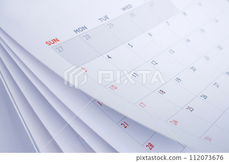Calendar page flipping sheet close up blur background business schedule planning appointment meeting concept Calendar page flipping sheet close up blur background business schedule planning appointment meeting concept 112073676