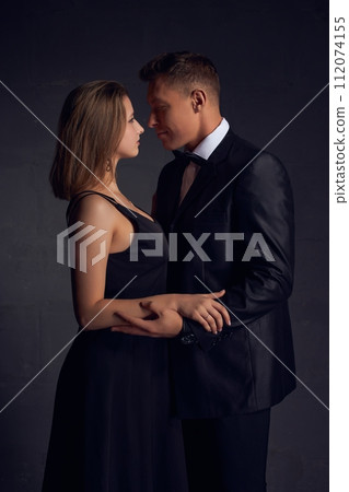 Loving couple on a date looking into each others eyes Loving couple on a date looking into each others eyes 112074155