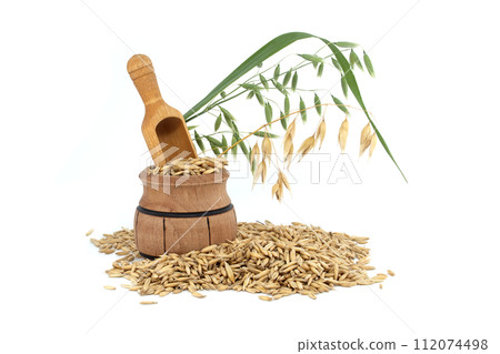 Whole oat grain seeds with hulls isolated on white Whole oat grain seeds with hulls isolated on white 112074498