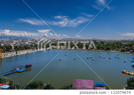 Top view from Ferris wheel of Altyn Eye Park and lake in Shymkent in summer Top view from Ferris wheel of Altyn Eye Park and lake in Shymkent in summer 112074674